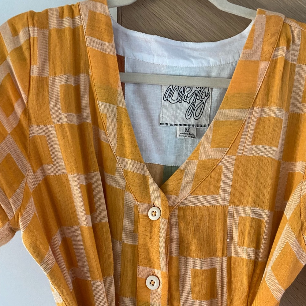 Ace & Jjg yellow print button down tie dress.